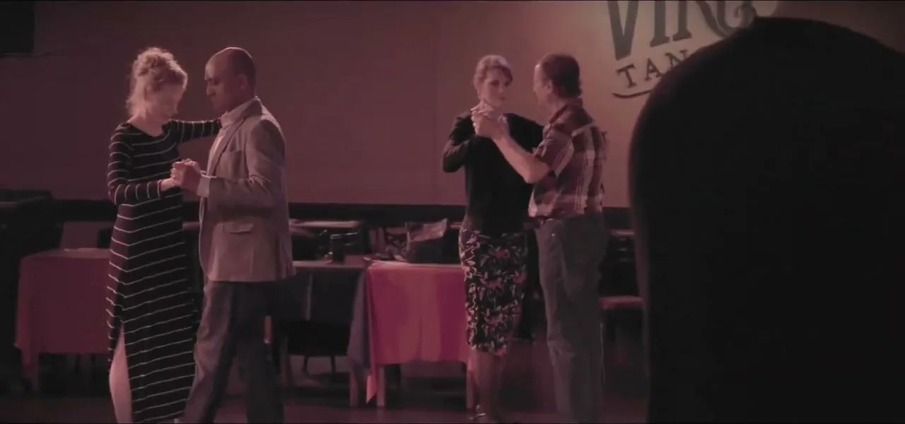 Couples of all ages dancing at a milonga in Buenos Aires, Argentina