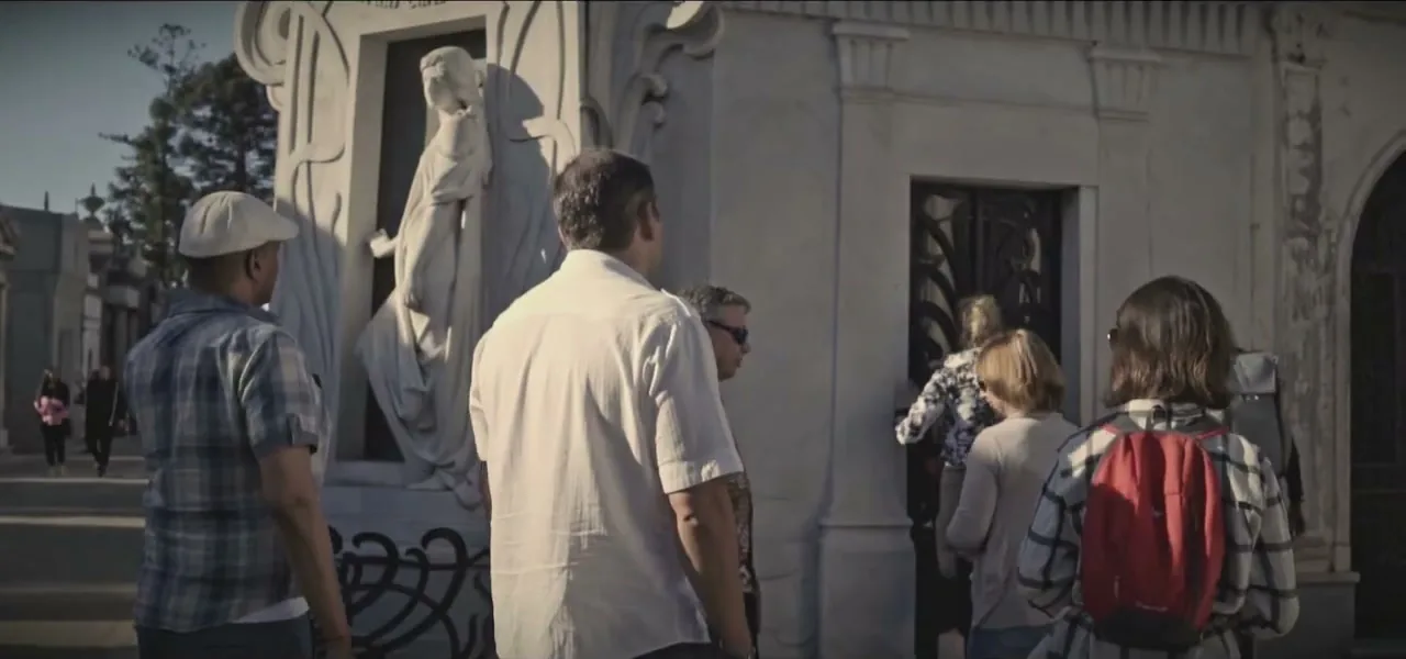 People walking among the marble mausoleums of Recoleta Cemetery in Buenos Aires, Argentina