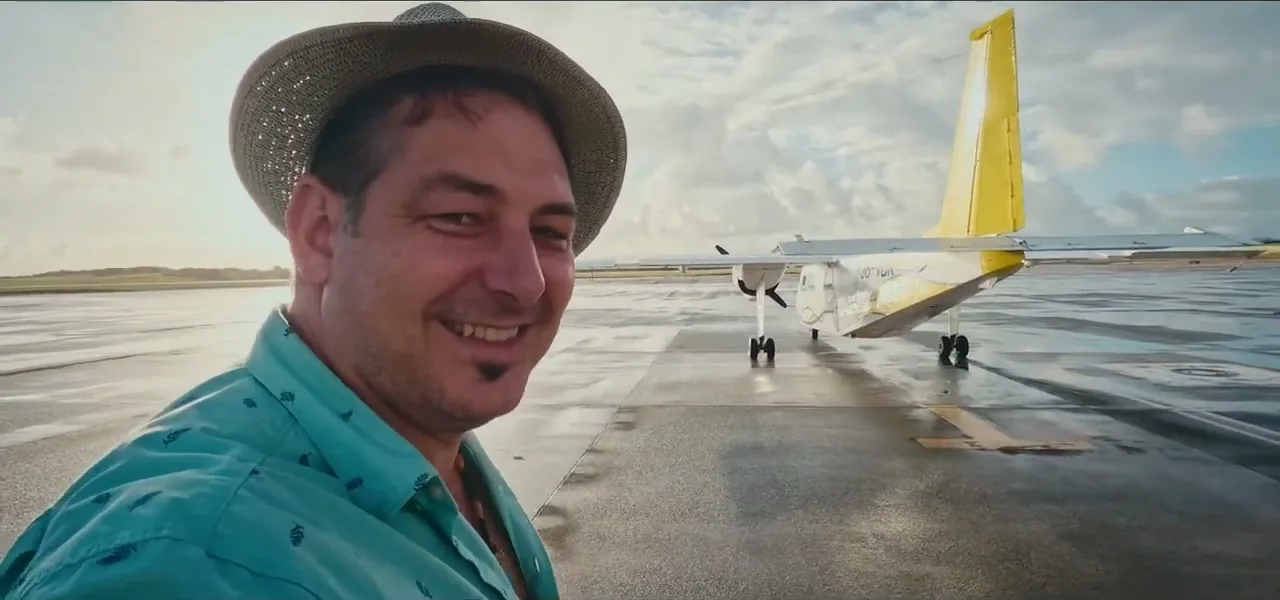 A small seven-seater plane on the runway in Barbuda