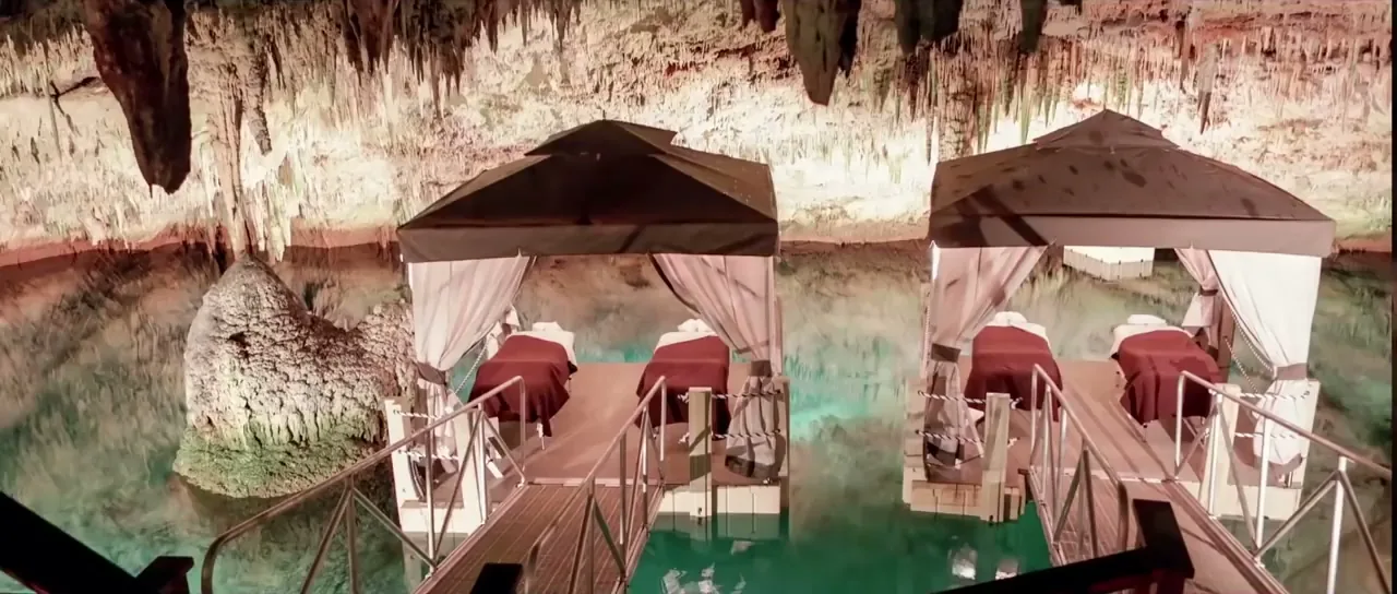 A limestone cave with formations and loungers used as a spa beneath a Bermuda hotel