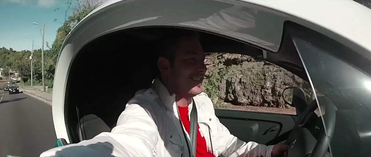Sorin driving a small Renault Twizy electric car in Bermuda