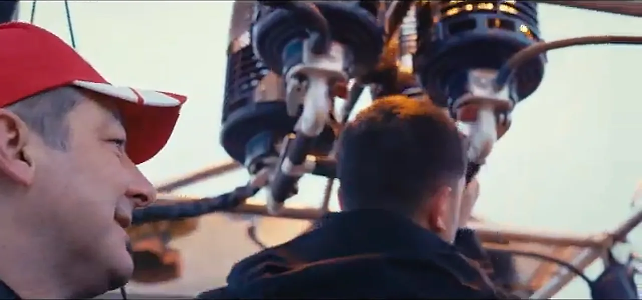 Sorin in a hot-air balloon basket with the burner roaring above