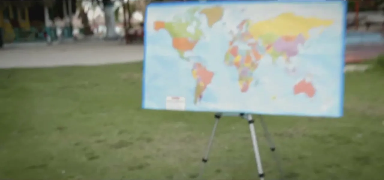 A world map on an easel set up for the dart throw on Tierra Bomba island, Colombia