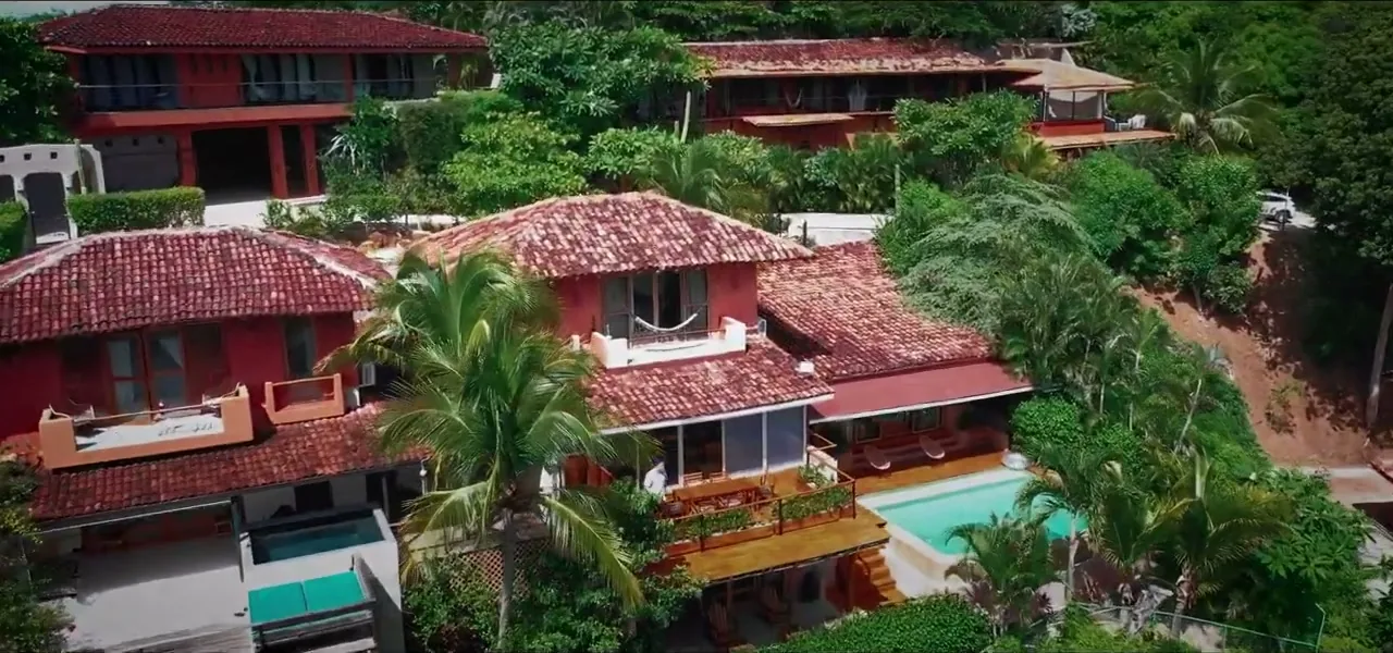 Aerial view of a hillside villa with a pool overlooking the jungle in Costa Rica