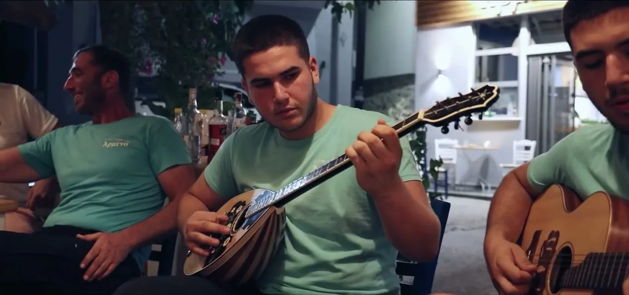 Musicians playing the laouto and lyra at a Cretan feast