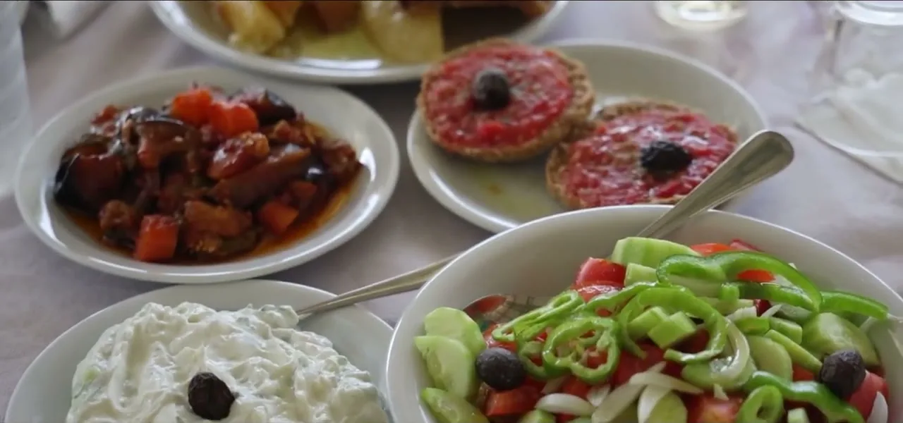 Traditional Cretan dishes including dakos, tzatziki and Greek salad