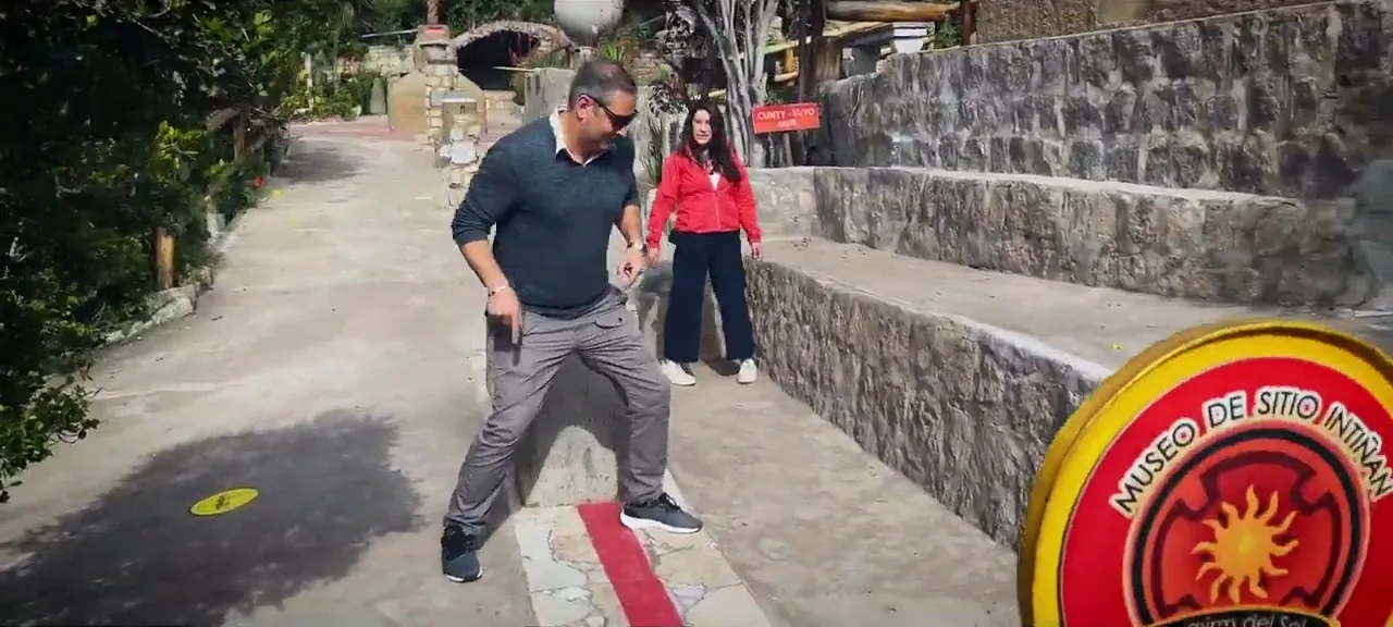 Sorin straddling the painted equator line at the Mitad del Mundo monument near Quito, Ecuador