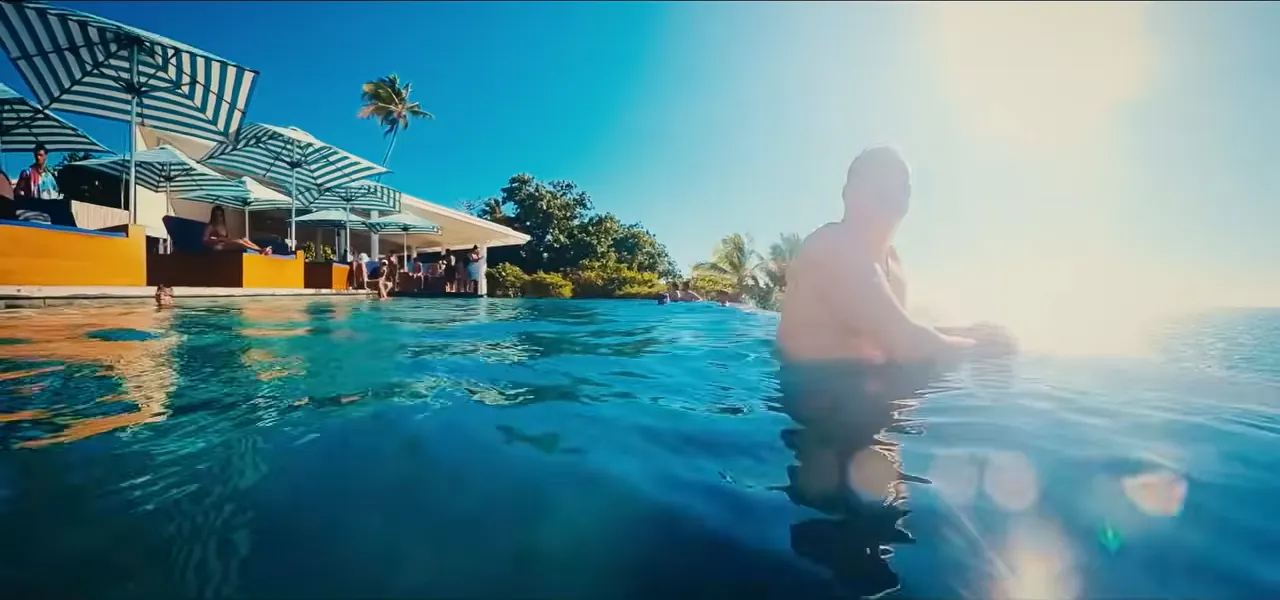 Sorin swimming at Malamala Beach Club, an island beach club in Fiji