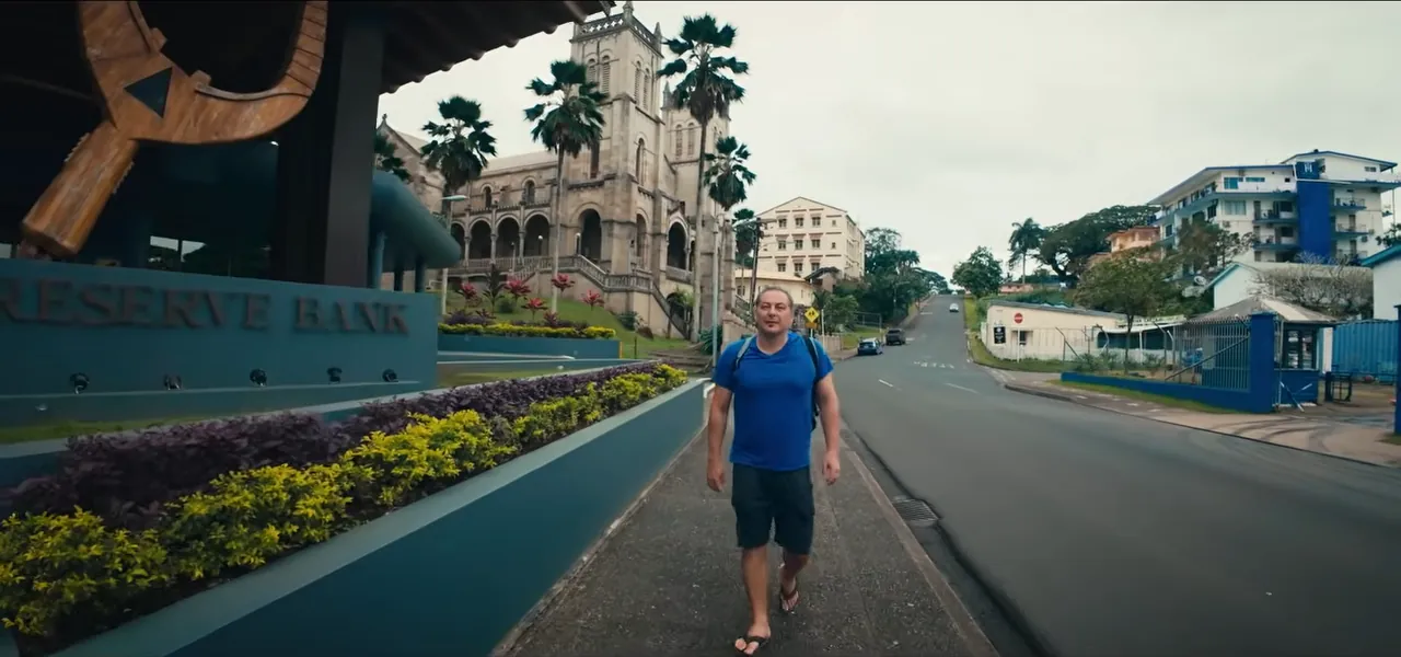 Sorin walking a street past the Reserve Bank in Suva, the capital of Fiji