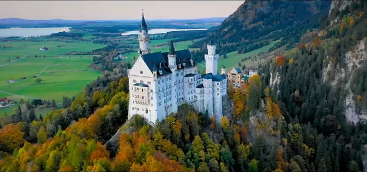 Neuschwanstein Castle on a wooded hill in the Bavarian Alps, Germany