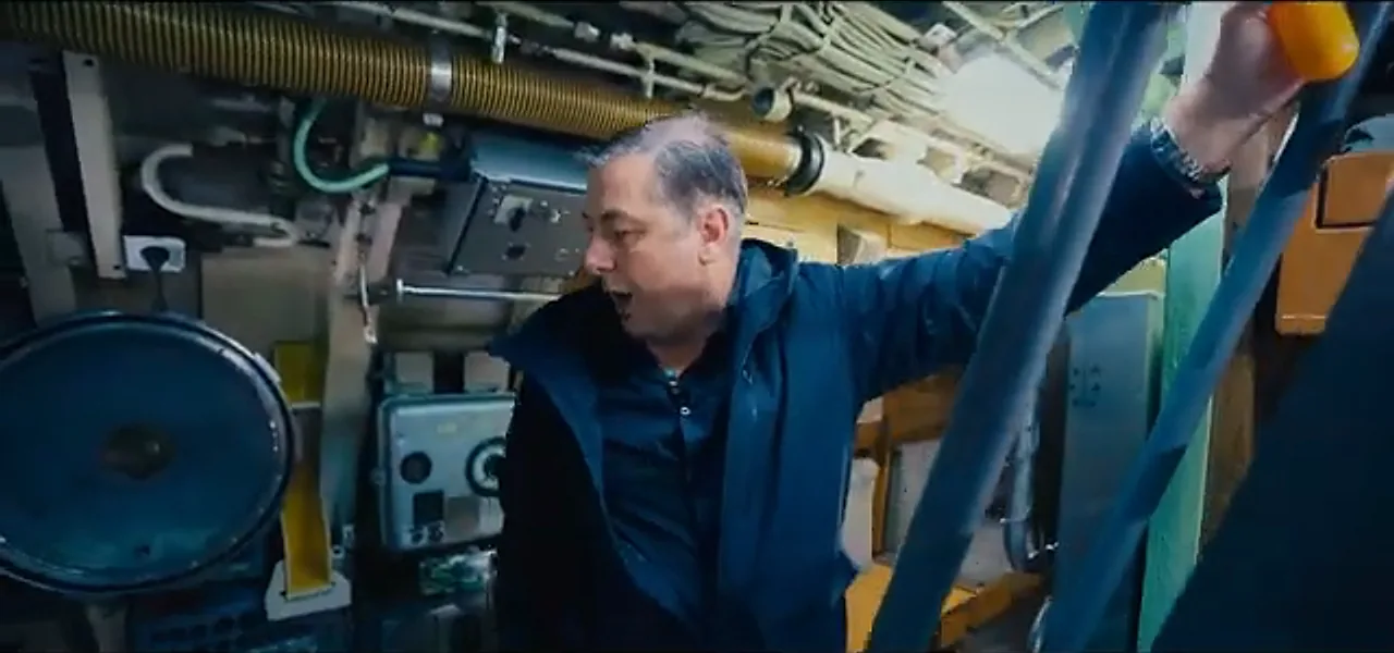Sorin climbing through the cramped interior of the U-9 submarine