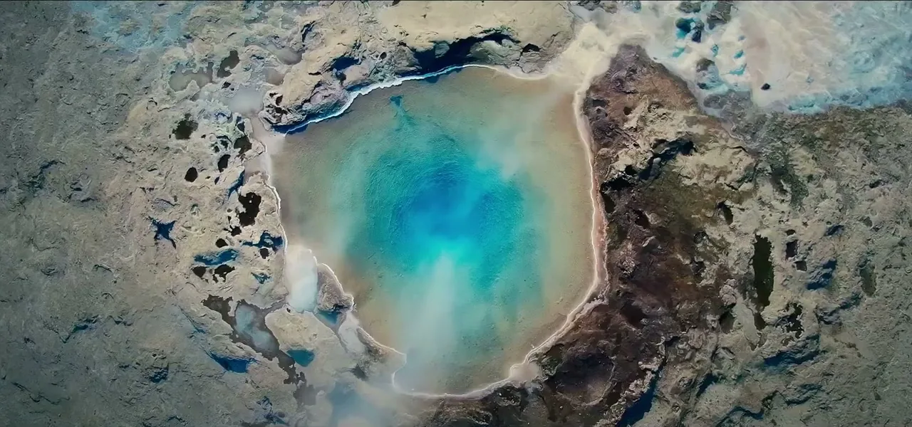 A vivid blue geothermal hot spring in the Geysir area of Iceland
