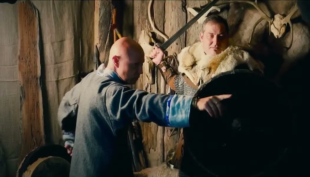 Sorin dressed as a Viking with a sword and shield in a studio in Iceland