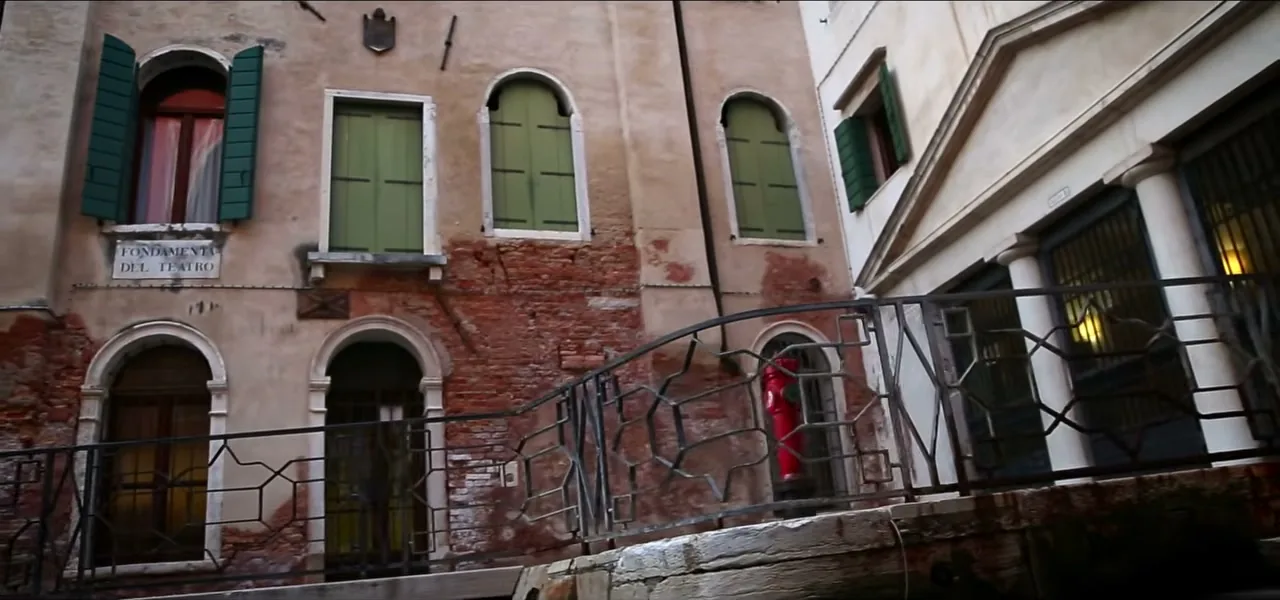 A quiet canal lined with old buildings in Venice, Italy