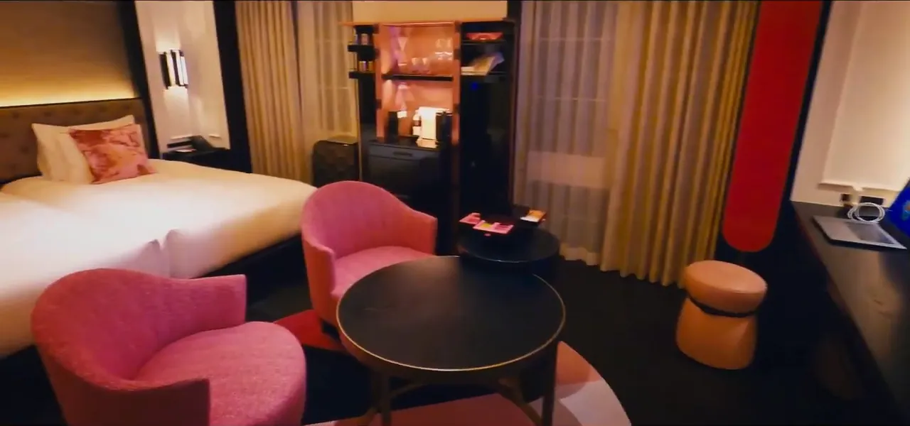 A hotel room decorated entirely in pink on a cherry-blossom theme in Kyoto