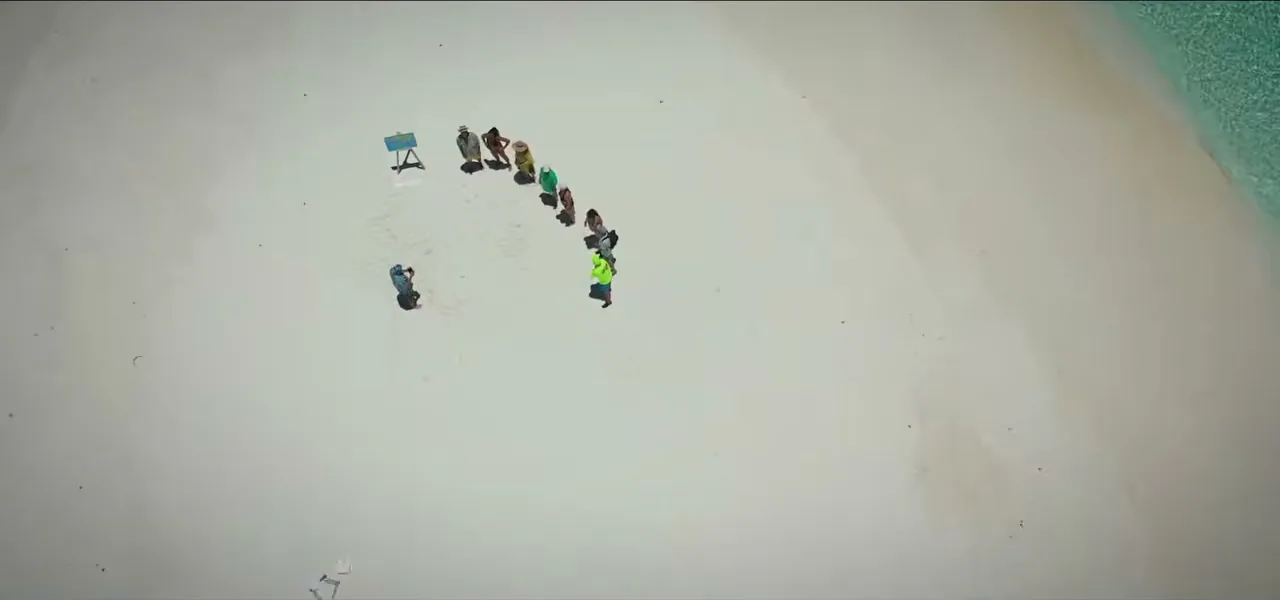 Aerial view of people on a tiny sandbank in the Indian Ocean for the dart-throwing ceremony, Maldives