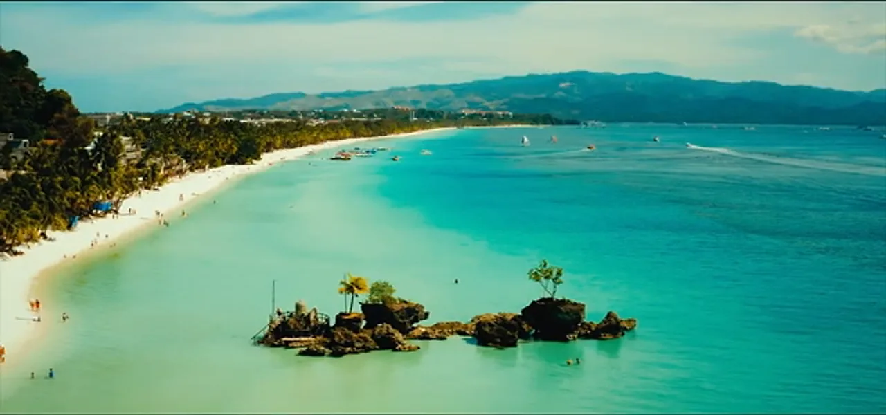The white sand and turquoise water of White Beach, Boracay, Philippines