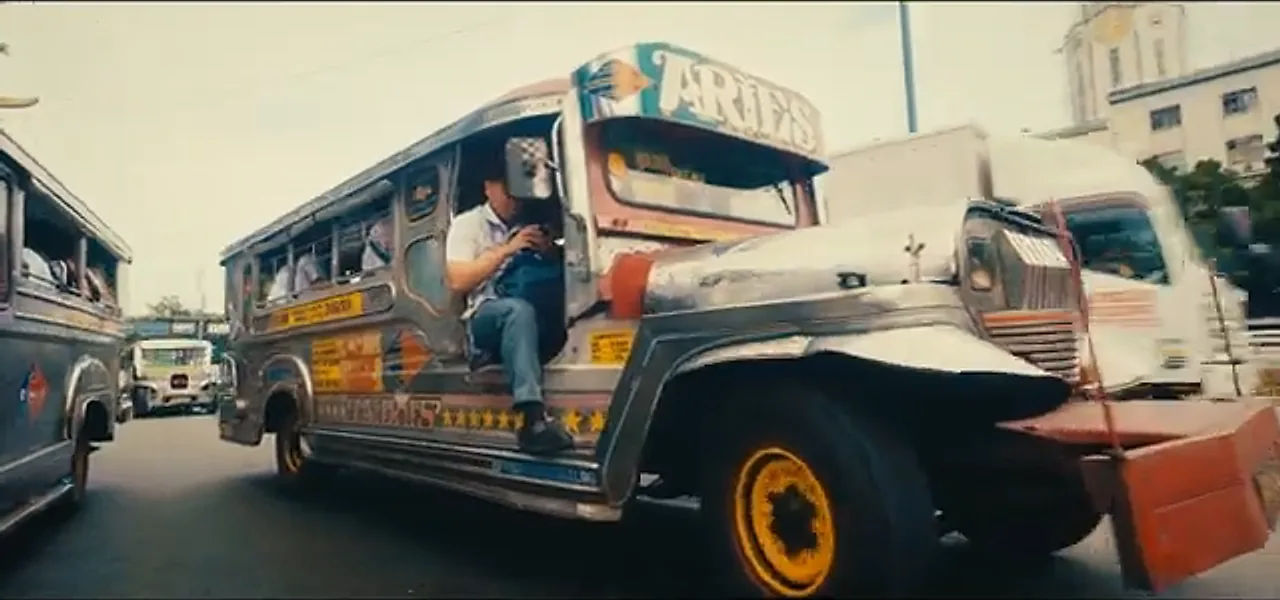 A colourful jeepney public bus on a street in Manila, Philippines