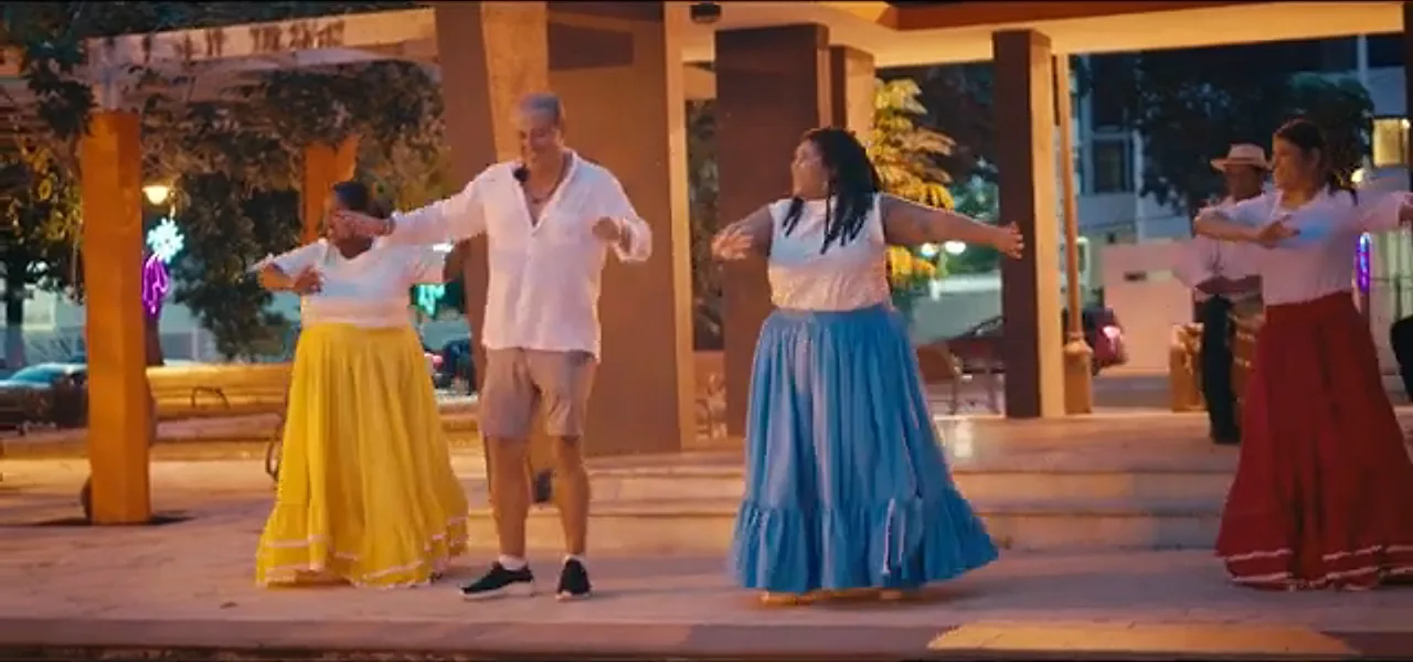 Sorin learning to dance Bomba with dancers in colourful skirts in Puerto Rico