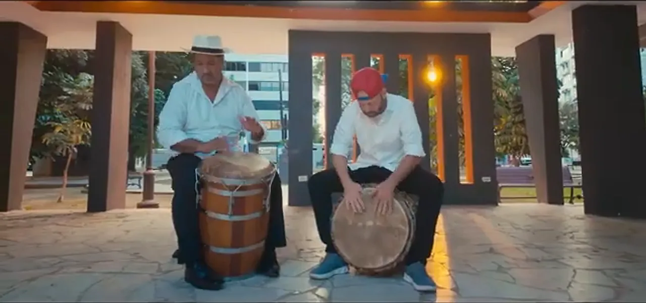 Two Bomba drummers of the Ayala family playing barrel drums in Loíza, Puerto Rico