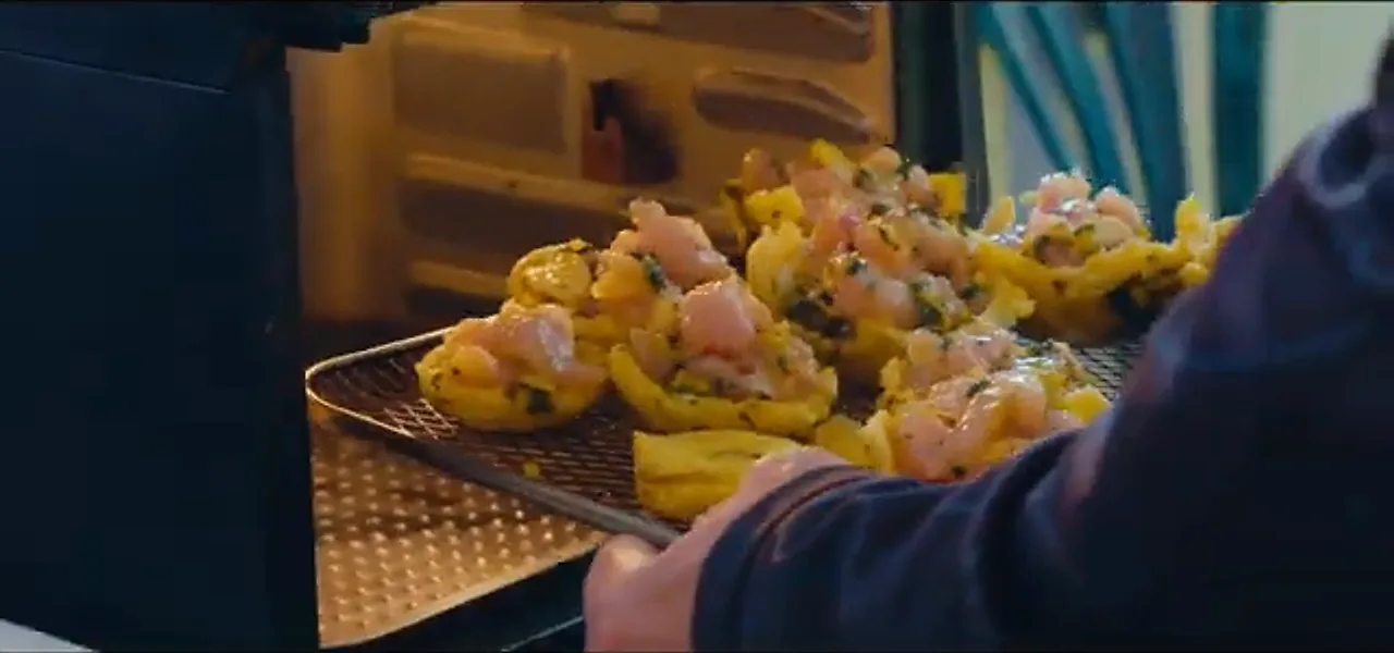 A tray of mofongo baskets filled with chicken, a traditional Puerto Rican dish