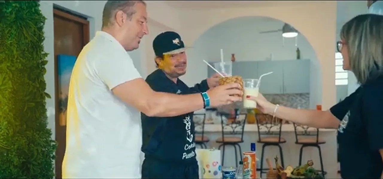 Sorin toasting a piña colada with a bartender in San Juan, Puerto Rico