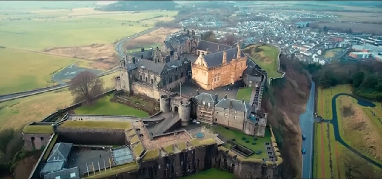 Aerial view of Stirling Castle on its rocky crag above the surrounding plain