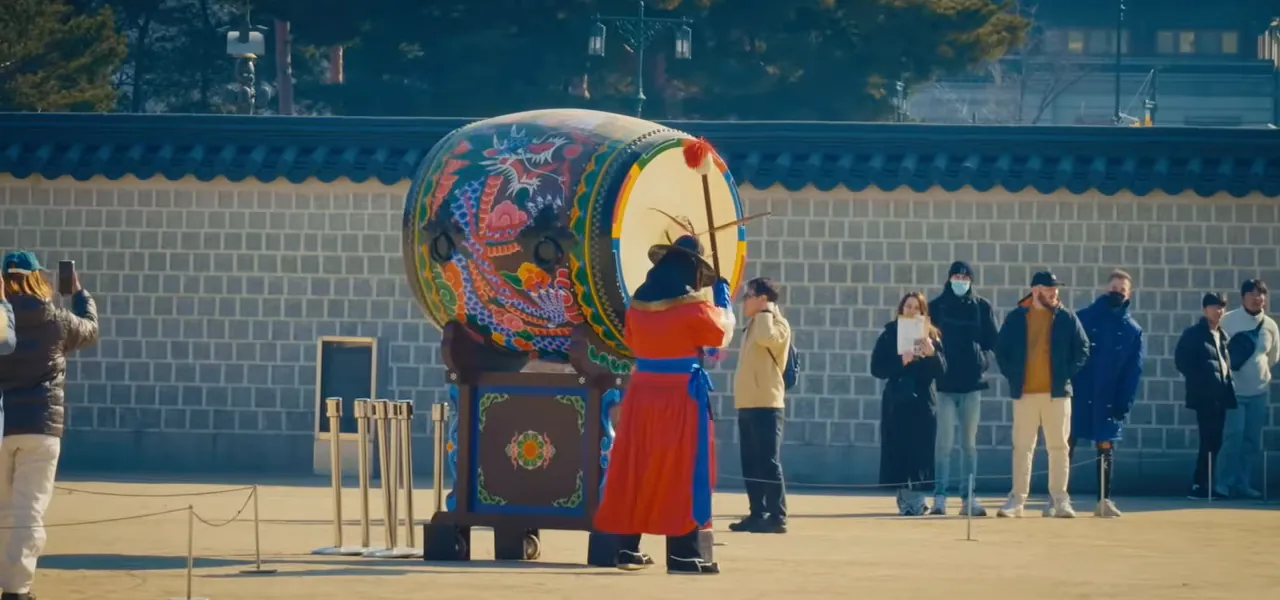 A costumed royal guard with a large painted drum at Gyeongbokgung Palace