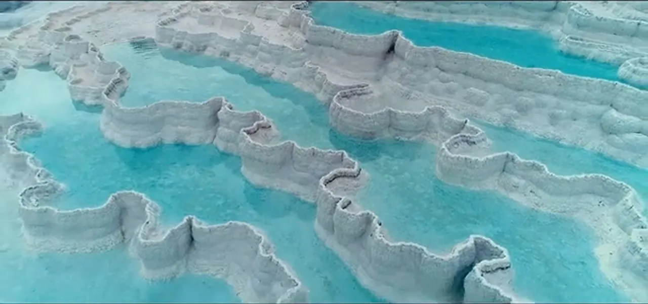 The white travertine terraces and turquoise pools of Pamukkale, Turkey